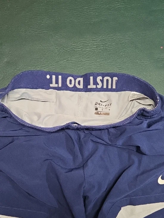 **Nike Women’s Purple Athletic Running Shorts with White Accents** - Picture 4 of 6